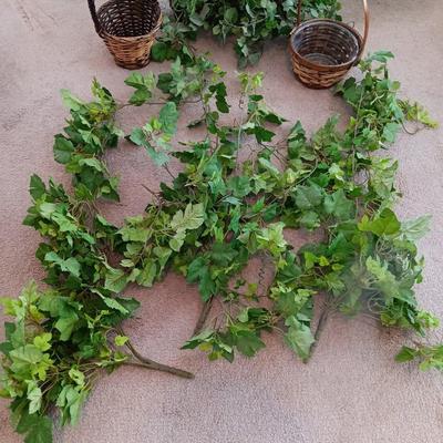 Faux ivy vines with basket of faux greenery and two wicker baskets