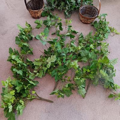 Faux ivy vines with basket of faux greenery and two wicker baskets