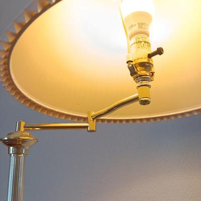 Brass adjustable swing-arm floor lamp