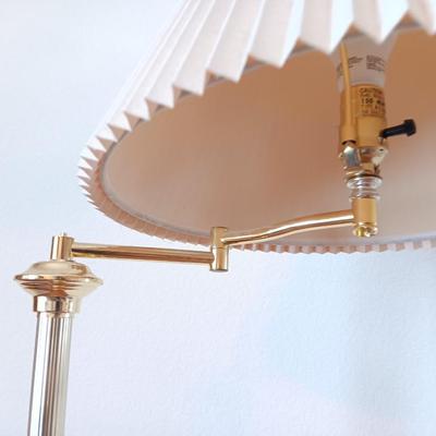 Brass adjustable swing-arm floor lamp