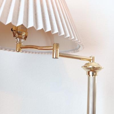 Brass adjustable swing-arm floor lamp