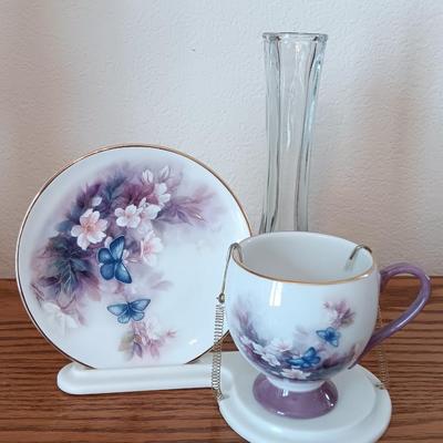 Matching butterfly cup & Saucer set with display base and a glass vase.