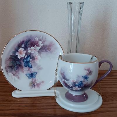 Matching butterfly cup & Saucer set with display base and a glass vase.
