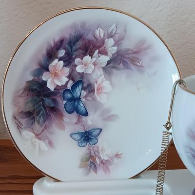 Matching butterfly cup & Saucer set with display base and a glass vase.