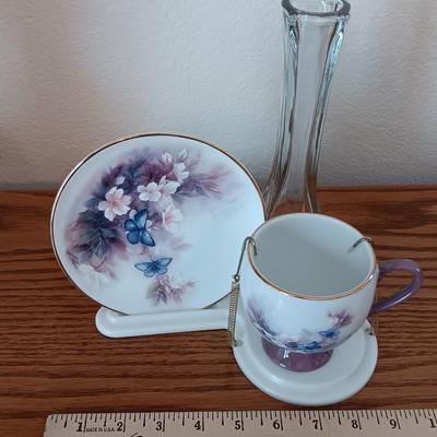Matching butterfly cup & Saucer set with display base and a glass vase.