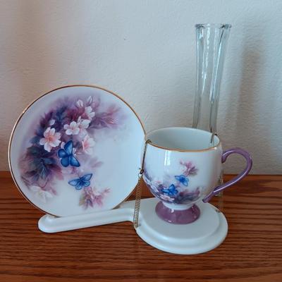 Matching butterfly cup & Saucer set with display base and a glass vase.
