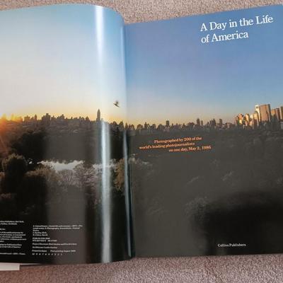 Two coffee table books - Great World Atlas and A Day in the life of America