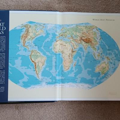 Two coffee table books - Great World Atlas and A Day in the life of America