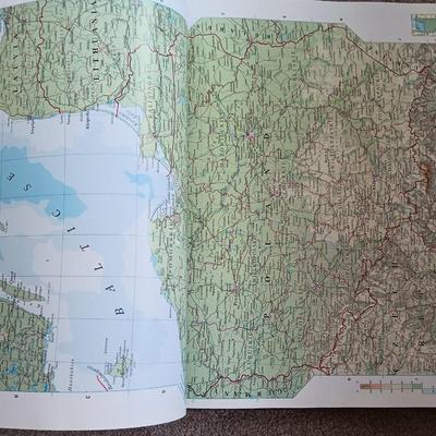 Two coffee table books - Great World Atlas and A Day in the life of America