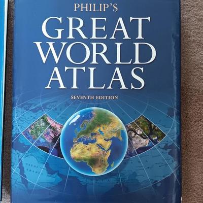 Two coffee table books - Great World Atlas and A Day in the life of America