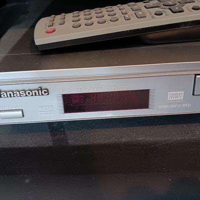 Panasonic DVD Player with remote control and an assortment of DVD videos