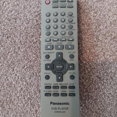 Panasonic DVD Player with remote control and an assortment of DVD videos