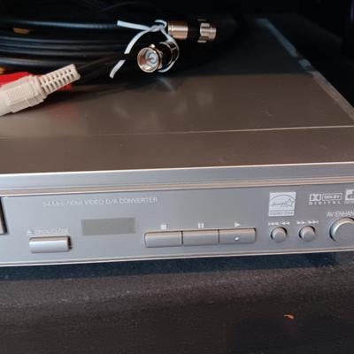 Panasonic DVD Player with remote control and an assortment of DVD videos