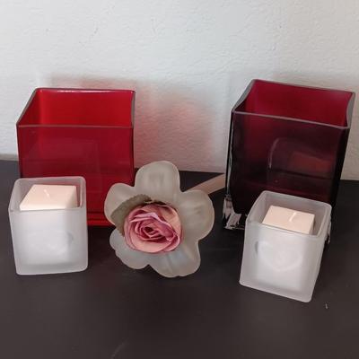 Red square vases with candle heart frosted votives and a glass flower