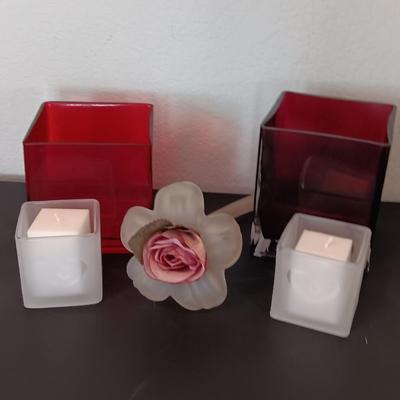 Red square vases with candle heart frosted votives and a glass flower