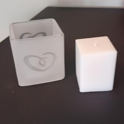 Red square vases with candle heart frosted votives and a glass flower