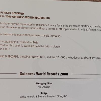 Two coffee table books - Guinness World Records 2000 Millennium edition and The Pictorial History of Baseball