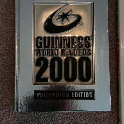 Two coffee table books - Guinness World Records 2000 Millennium edition and The Pictorial History of Baseball