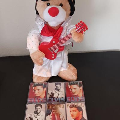 Plush Elvis singing bear with Elvis cassettes and other cassettes.