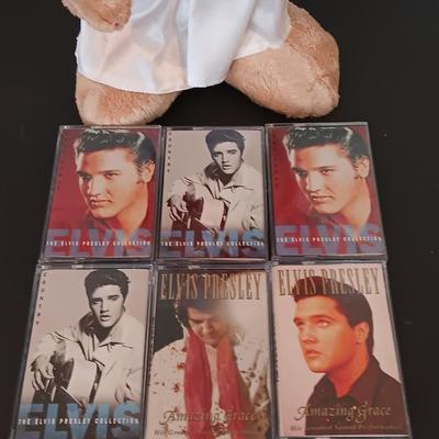 Plush Elvis singing bear with Elvis cassettes and other cassettes.