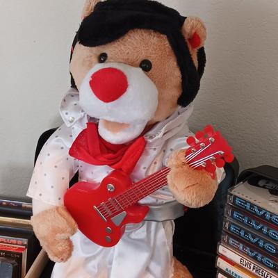 Plush Elvis singing bear with Elvis cassettes and other cassettes.