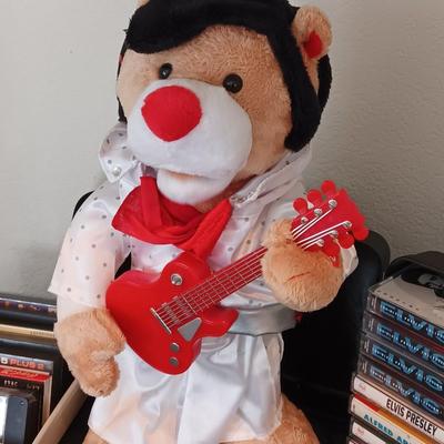 Plush Elvis singing bear with Elvis cassettes and other cassettes.