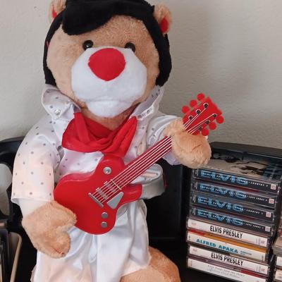 Plush Elvis singing bear with Elvis cassettes and other cassettes.