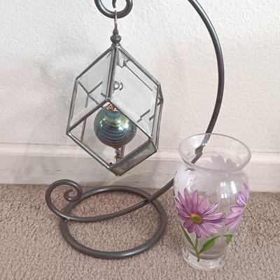 Metal framed display with glass prism and friendship ball and a hand painted floral vase