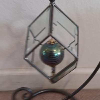 Metal framed display with glass prism and friendship ball and a hand painted floral vase