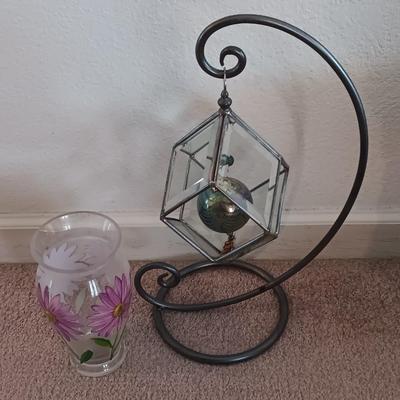 Metal framed display with glass prism and friendship ball and a hand painted floral vase