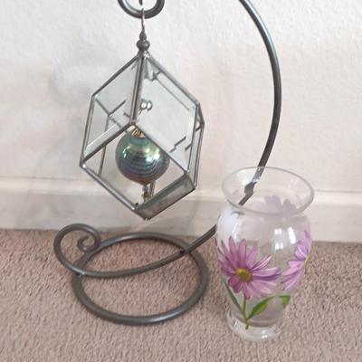 Metal framed display with glass prism and friendship ball and a hand painted floral vase