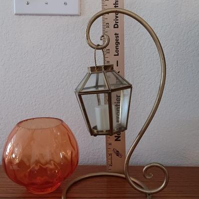 Metal display hanger with glass prism and vintage round orange glass bulb vase