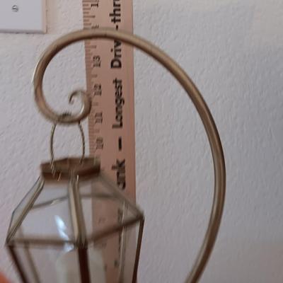 Metal display hanger with glass prism and vintage round orange glass bulb vase