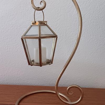 Metal display hanger with glass prism and vintage round orange glass bulb vase