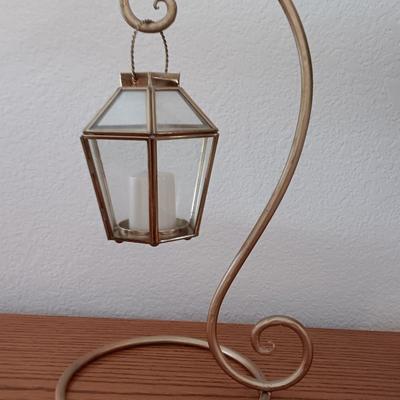 Metal display hanger with glass prism and vintage round orange glass bulb vase