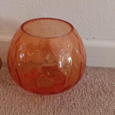 Metal display hanger with glass prism and vintage round orange glass bulb vase