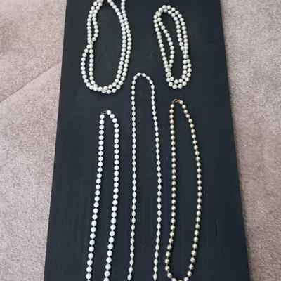 Five Beaded faux pearl necklaces.