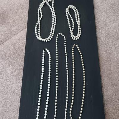 Five Beaded faux pearl necklaces.