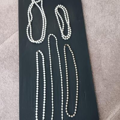 Five Beaded faux pearl necklaces.