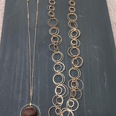 Two necklaces large ring chain and chain with chestnut
