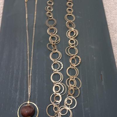 Two necklaces large ring chain and chain with chestnut