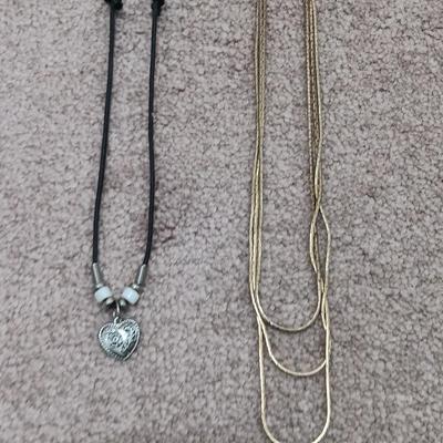 Gold toned 3 chain necklace and a Heart pendant necklace