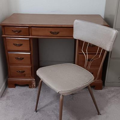 small seven drawer student desk with vintage chair