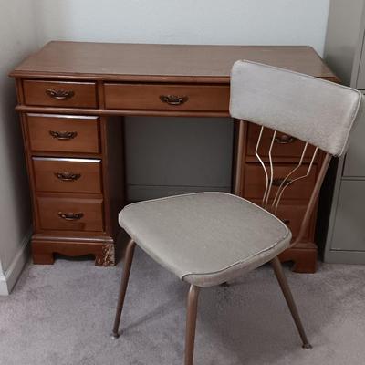 small seven drawer student desk with vintage chair