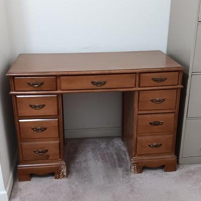 small seven drawer student desk with vintage chair