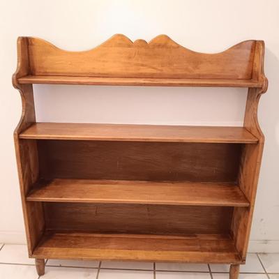 Narrow wooden bookshelf