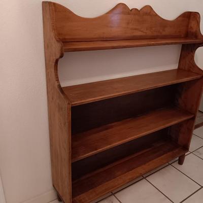 Narrow wooden bookshelf