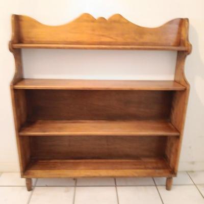 Narrow wooden bookshelf