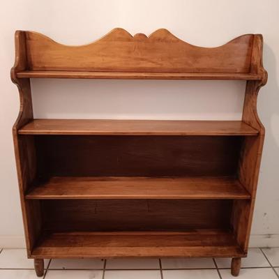 Narrow wooden bookshelf