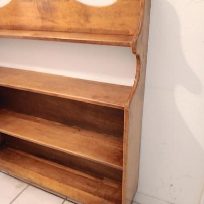 Narrow wooden bookshelf